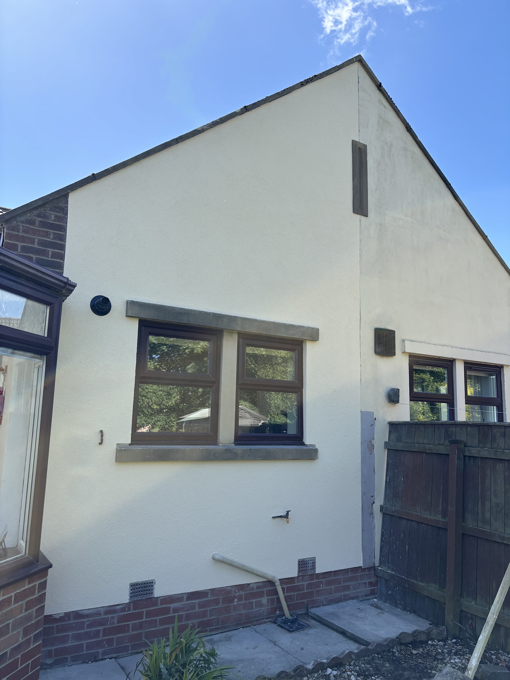 Cream render finished on a bungalow gable end