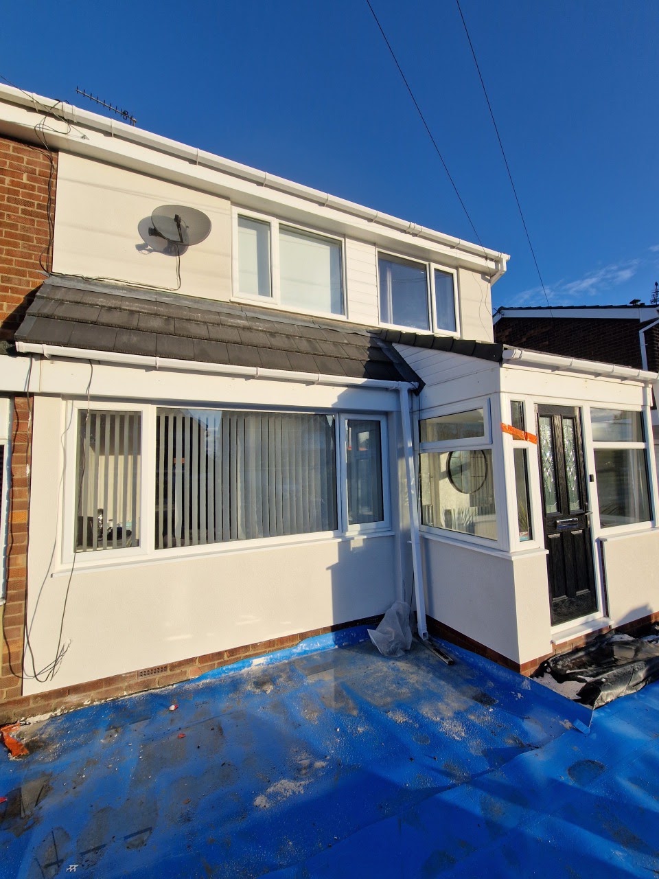 Freshly rendered semi-detached house with porch